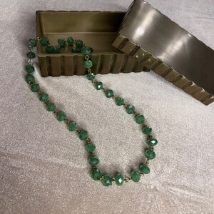 28 inch green and gold glass bead strand